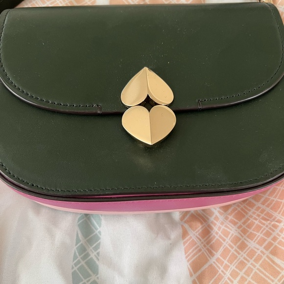 Kate Spade

lula small saddle bag

Shades of purple peekaboo at the bottom - Picture 2 of 6